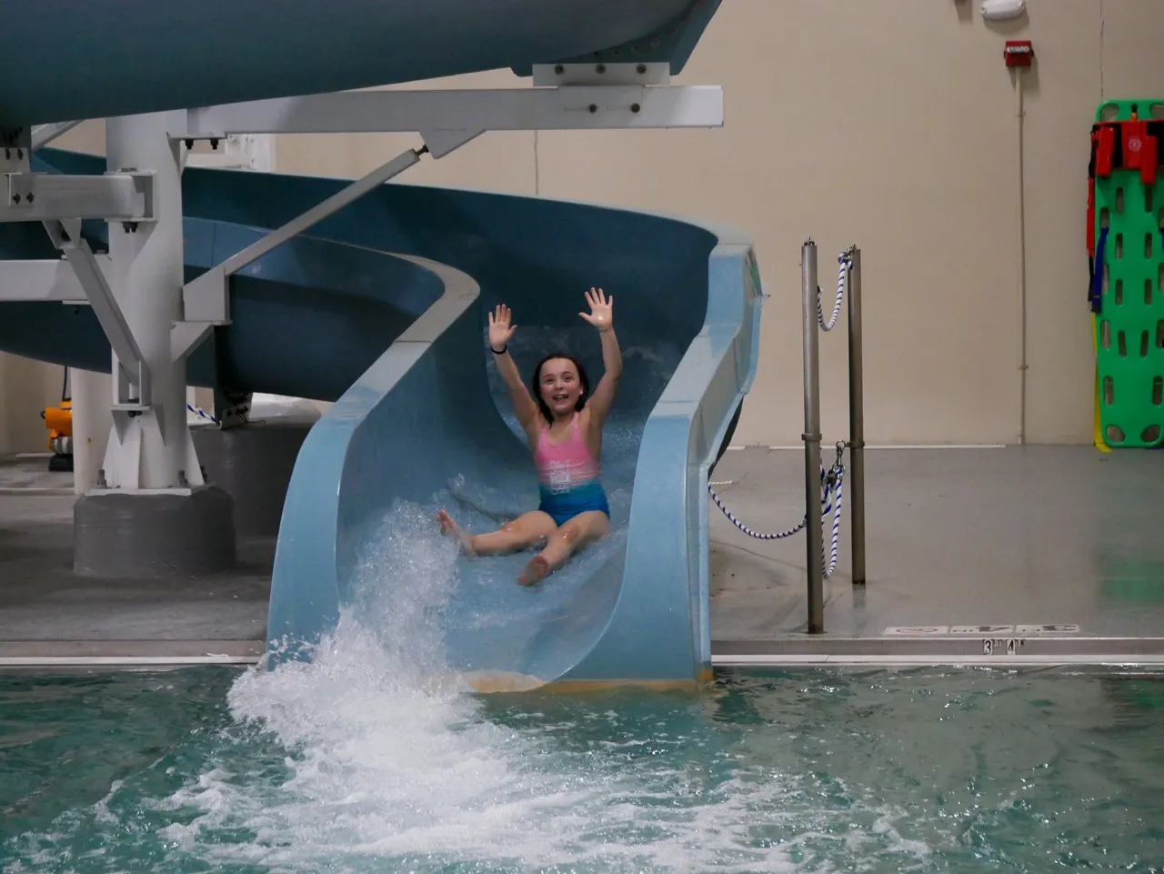 child going down the water slide