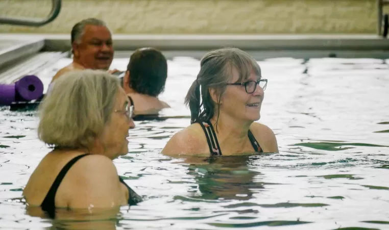 women in a water aerobics class