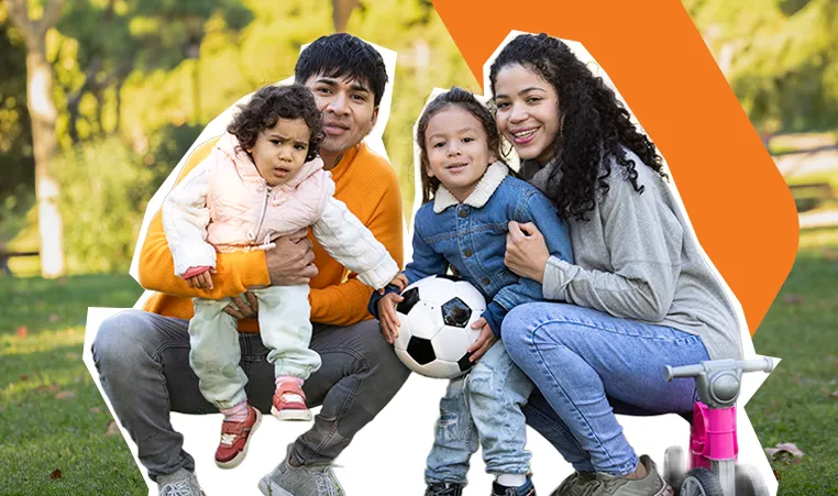 family of four playing soccer
