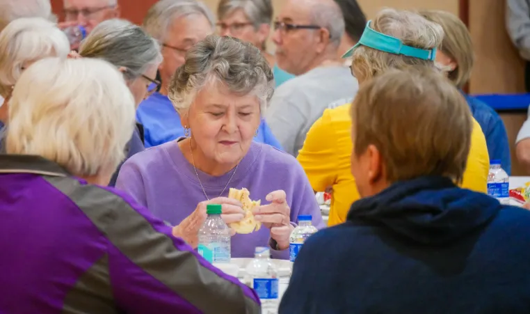 senior women enjoying a meal together