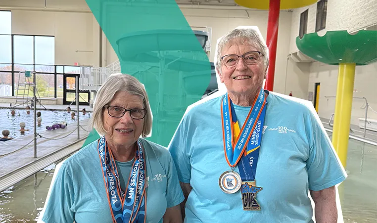 Sandy and Peggy smiling in the Aquatic Center