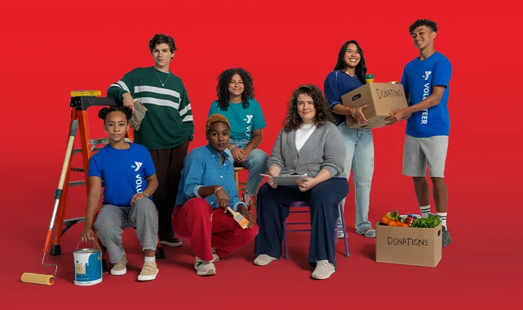 a group of volunteers in a red studio