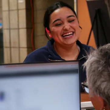 woman checking in at the YMCA front desk