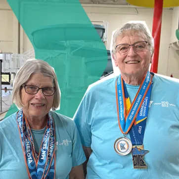 Sandy and Peggy smiling in the Aquatic Center