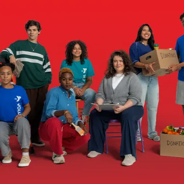 a group of volunteers in a red studio